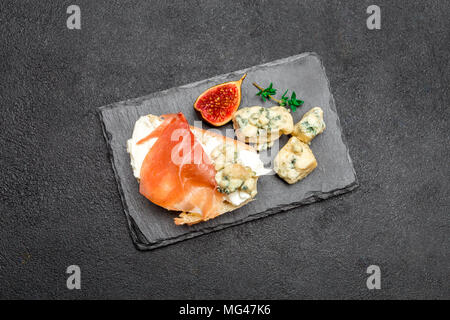 Bruschetta with ham, blue ceese and fresh figs Stock Photo