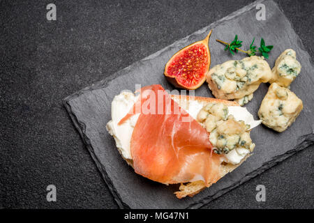 Bruschetta with ham, blue ceese and fresh figs Stock Photo