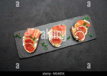 Bruschetta with ham, blue ceese and fresh figs Stock Photo