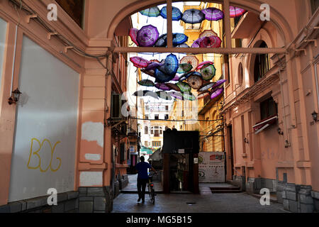 BUCHAREST, ROMANIA - APRIL 22, 2018. Rainbow umbrellas roof street in Victory Passage , Bucharest, Romania Stock Photo