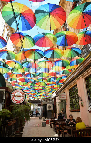 BUCHAREST, ROMANIA - APRIL 22, 2018. Rainbow umbrellas roof street in Victory Passage , Bucharest, Romania Stock Photo