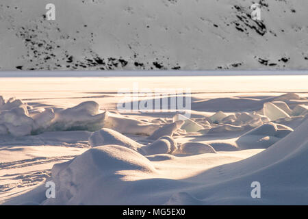 Broken ice floes and the smooth ice of a frozen fjord on Baffin Island, Nunavut, Arctic, Canada Stock Photo