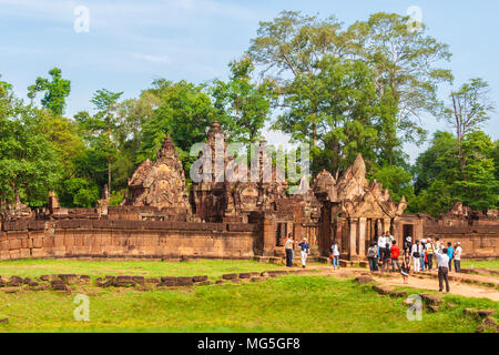 Tourists entering the east gopura of the second enclosure in the Banteay Srei (Citadel of the Women) temple. Taken in Siem Reap, Cambodia. Stock Photo