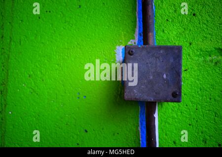 Electrical Box on Green Concrete Wall. Stock Photo