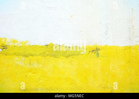 Yellow and White in Half Painting on Old Concrete Wall Background. Stock Photo