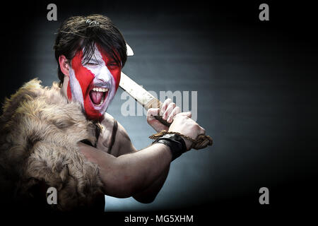 Portrait of screaming in rage ancient Spartan warrior in battle dress  against sky background Stock Photo - Alamy