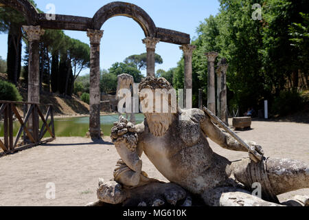 Lounging statue figure at the curved north end of the monumental mystical Canopus. Villa Adriana. Tivoli. Italy. The Canopus is a reflecting pool 228  Stock Photo