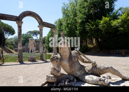 Lounging statue figure at the curved north end of the monumental mystical Canopus. Villa Adriana. Tivoli. Italy. The Canopus is a reflecting pool 228  Stock Photo