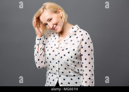Joyful positive woman touching her hair Stock Photo