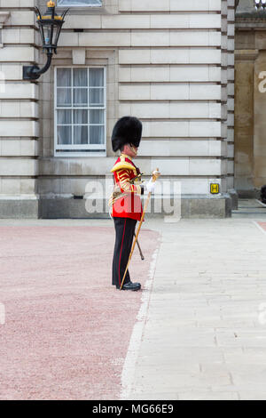 London, United Kingdom - April 23, 2015: The Drum Major carries a mace while guiding a military band in the grounds of Buckingham Palace. Stock Photo