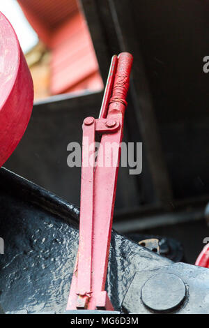 Gloucester, United Kingdom - March 28, 2015: A crane in Gloucester Dicks driven by steam and here showing the handbrake painted in red. Stock Photo