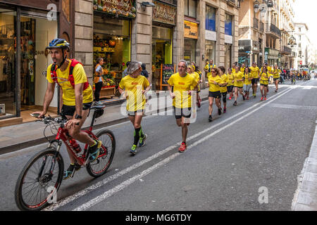 April 27, 2018 - Barcelona, Spain - The first group of runners arrives at Barcelona City Council where they will be received by prominent Catalan politicians. Volunteer runners, in relays, will run the almost 700 kilometers that separate the prisons of Estremera and Soto Real in Madrid from the capital of Catalunya, Barcelona. On the 30th, at the end of the race, the participants will hand over to the Catalan political prisoners the support notes collected in nine agenda books, as well as the signatures of outstanding Catalan politicians. (Credit Image: © Paco Freire/SOPA Images via ZUMA Wire) Stock Photo