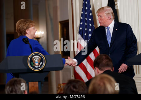 Washington, USA. 27th Apr, 2018. U.S. President Donald Trump (R) attends a joint press conference with German Chancellor Angela Merkel at the White House in Washington, DC, the United States, on April 27, 2018. Credit: Ting Shen/Xinhua/Alamy Live News Stock Photo