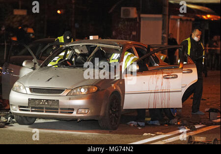 Kiev, Ukraine. 28th Apr, 2018. Ukrainian police officers investigate the scene of a grenade explosion within a car, in Kiev, Ukraine, on 28 April 2018. According to local media reports, one unidentified man was killed and another one injured after a grenade exploded inside of a car. Credit: Serg Glovny/ZUMA Wire/Alamy Live News Stock Photo