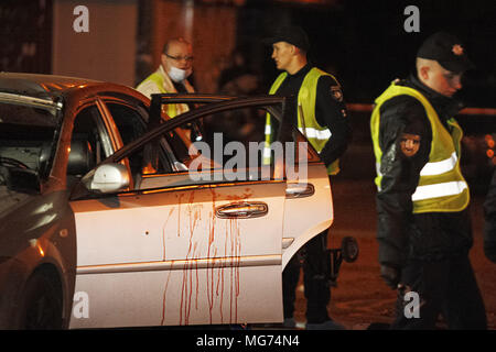 Kiev, Ukraine. 28th Apr, 2018. Ukrainian police officers investigate the scene of a grenade explosion within a car, in Kiev, Ukraine, on 28 April 2018. According to local media reports, one unidentified man was killed and another one injured after a grenade exploded inside of a car. Credit: Serg Glovny/ZUMA Wire/Alamy Live News Stock Photo