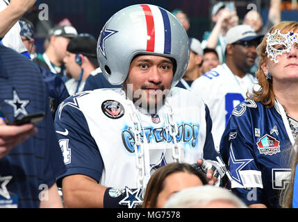 April 27, 2018: A Dallas Cowboys fan shows off 5 replica Super Bowl rings  for each of the Cowboys championship victories during the second round of  the 2018 NFL Draft at AT&T