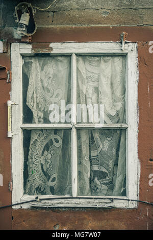 Window with curtain in an old building Stock Photo