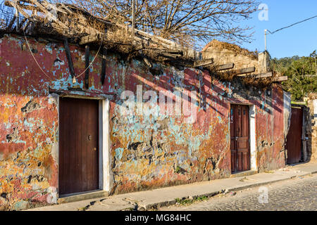 Antigua, Guatemala - March 19, 2017: Old, crumbling wall of abandoned house in colonial city & UNESCO World Heritage Site of Antigua Stock Photo