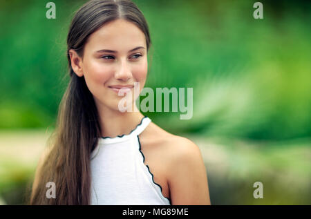 Portrait Of Attractive Girl Without Makeup Looking At Camera And Smiling On Isolated White Background Young Female With Natural Beauty Posing In Studio Concept Of Skin Care And Health Stock Photo