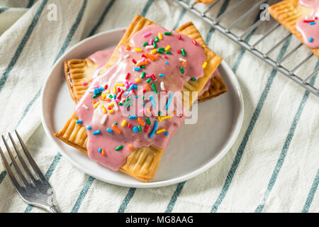 Sweet Homemade Strawberry Toaster Pastries with Sprinkles Stock Photo