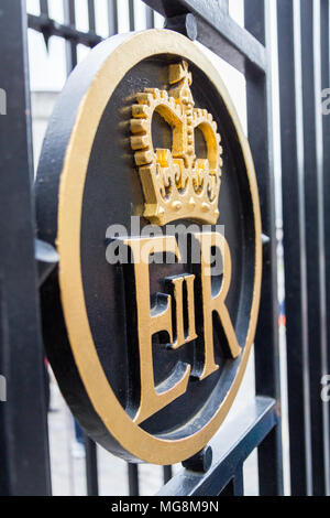 London, United Kingdom - May 2, 2015: The Elizabeth II Regina, Royal Cipher on a metal gate in gold and black. Stock Photo