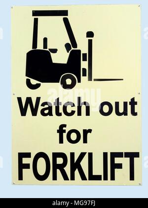 A warning sign informing people to care because forklift trucks are in operation in the area Stock Photo