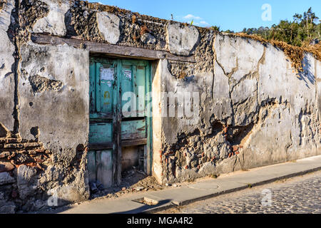 Antigua, Guatemala - March 19, 2017: Old, crumbling wall of abandoned house in colonial city & UNESCO World Heritage Site of Antigua Stock Photo