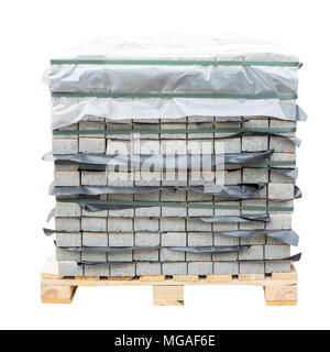 Stack of gray pavement slab on wooden base. Concrete stone paving flag. Isolated on white Stock Photo