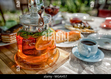 Tea with lemon fruit on the table in Armenia reen, drink, healthy, natural, herbal, tealeaves, cup, hot