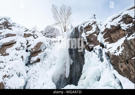 Water fall, half frozen half not. Hamadan Mountains,Iran Stock Photo