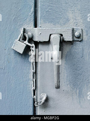 Padlock on blue door Stock Photo