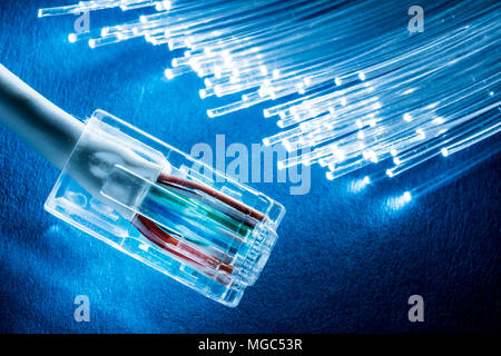 Network cable and optical fibers with lights. Stock Photo