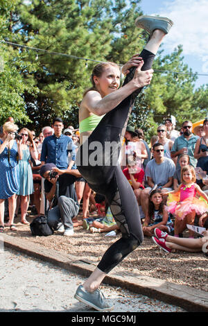 A young female dancer with the Atlanta Ballet demonstrates her flexibility during a Wabi Sabi dance performance on August 6, 2016 in Atlanta, GA. Stock Photo
