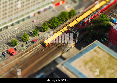 Aerial view of the S-Bahn tracks rapid train and tram train at the Alexanderplatz public square in Berlin. with tilt-shift effect. Stock Photo