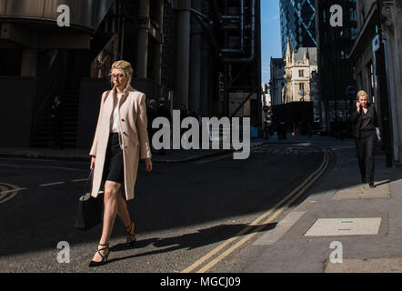 Two businesswomen walking along street, City of London, London, England Stock Photo