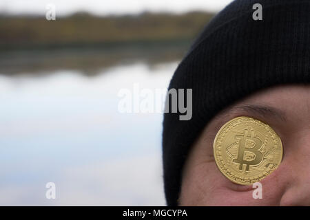 a serious man with bitcoin (new virtual money ) Stock Photo