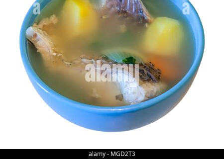 Bowl of fish soup isolated on white background. Stock Photo