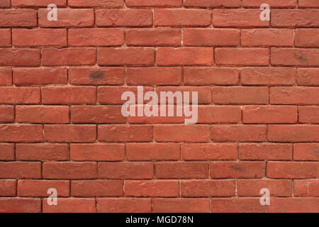 Masonry wall of red brick in the background Stock Photo