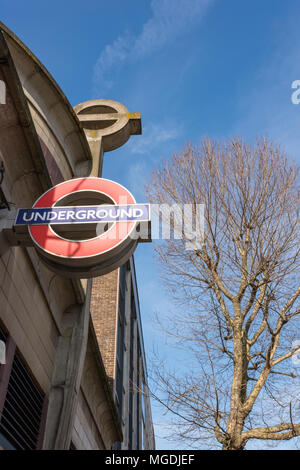 transport for london TFL underground station at borough high street in central london with the old vintage sign made of concrete and the new style too. Stock Photo