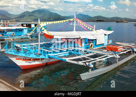 Filipino inter-island passenger pump boat known locally as a bangka or paraw in the Visayas docked in Puerto Princesa, Palawan, Philippines. Stock Photo