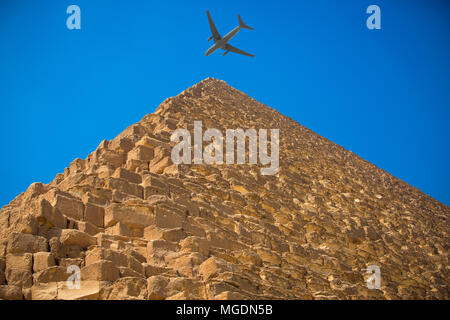 tourist plane flies over the pyramids of Cairo Egypt Stock Photo