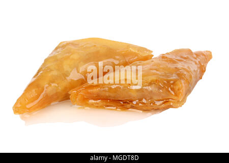 Baklava - an Arabian sweet made with baked filo, stuffed with crushed nuts and basted with honey or sugar syrup. Stock Photo