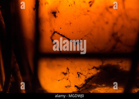 Old lamp. It has spider webs and dust .dark and mysterious atmosphere .Extreme close up Stock Photo