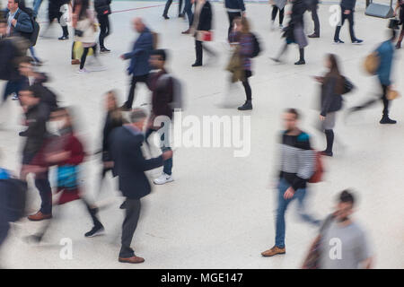Blurred figures rushing to catch a train Stock Photo
