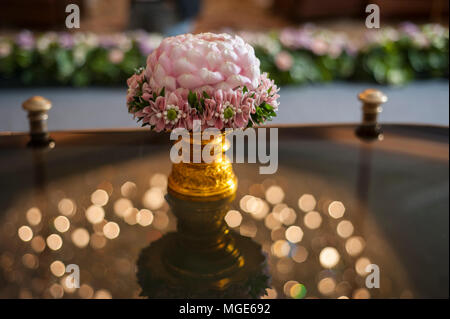 Thai traditional wedding accessories,pink garland and flower made from rose petal on golden tray Stock Photo