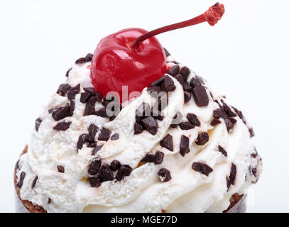 Black forest cake, topped with whipped cream and cherry isolated on white Stock Photo