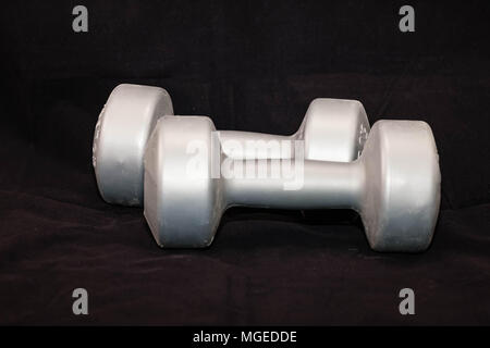 two silver five pound hand weights for exercise Stock Photo
