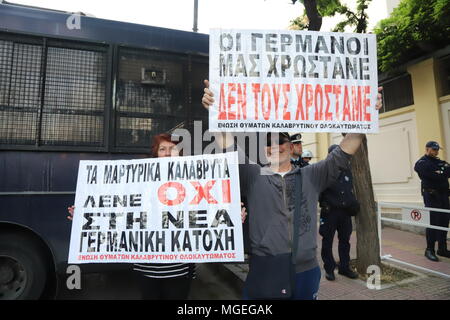 Athens, Greece. 27th Apr, 2018. reeks demonstrate in Athens rembering the anniversary of the sart of Occupation of Athens by the Nazis in WW2 and demanding from Germany to pay possible war reparations over the damage done by the Nazi war machine in Greece.It shoud be noted that German state insists the issue of compensation was previously setled in 1990. Credit: George Panagakis/Pacific Press/Alamy Live News Stock Photo