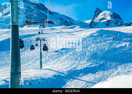 View of cable car to Klein Matterhorn Station with the ski track on the snow at Zermatt Village in Switzerland Stock Photo