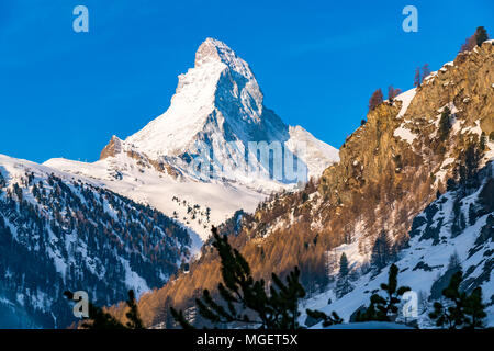 View of snowy Matterhorn Peak with blue sky in the morning sunny day at Zermatt in Switzerland Stock Photo